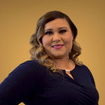 Headshot of Juanita Alcantar, real estate agent