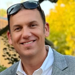 Headshot of Christopher Slinker, real estate agent