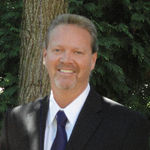 Headshot of Ken Thomson, real estate agent