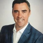 Headshot of Tim Collins, real estate agent