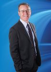 Headshot of Christopher Hennessy, real estate agent
