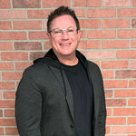 Headshot of Andrew Myers, real estate agent