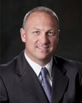 Headshot of Marc Woods, real estate agent
