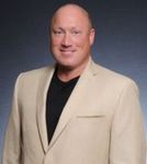 Headshot of Scott Adamek, real estate agent