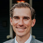 Headshot of Justin Landis, real estate agent