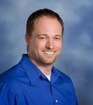 Headshot of Cory Oberg, real estate agent