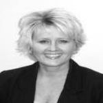 Headshot of Stacy West, real estate agent