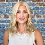 Headshot of Kate Seemann, real estate agent