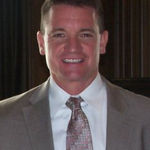 Headshot of Troy Hodell, real estate agent