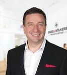 Headshot of Paul Benson, real estate agent