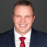 Headshot of Adam Stary, real estate agent