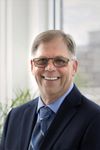 Headshot of John Magnusson, real estate agent