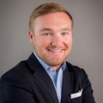 Headshot of Jordan Gallas, real estate agent