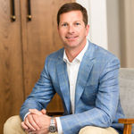 Headshot of Bryan Sinnett, real estate agent