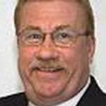 Headshot of Dennis Mooney, real estate agent
