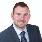 Headshot of Ryan Dallas, real estate agent