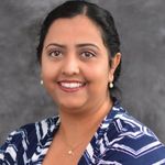 Headshot of Monika Dhand, real estate agent