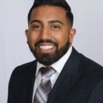 Headshot of Tiju Abraham, real estate agent