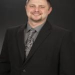 Headshot of Travis Johnson, real estate agent