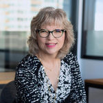 Headshot of Jackie Mack, real estate agent