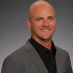 Headshot of Neil Theisen, real estate agent