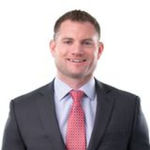 Headshot of Kyle Bender, real estate agent