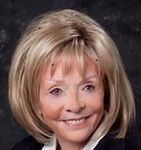 Headshot of Mickie Shea, real estate agent
