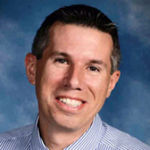 Headshot of AJ DePue, real estate agent