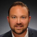 Headshot of Logan Abrams, real estate agent