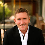 Headshot of Nate Evans, real estate agent
