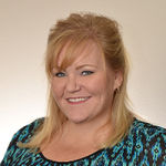 Headshot of Mindi Dawkins, real estate agent