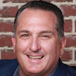 Headshot of John Newton, real estate agent