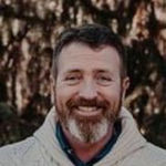 Headshot of Gregory Mayo, real estate agent