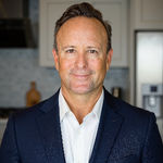 Headshot of Adrian Gomez, real estate agent