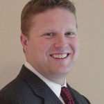 Headshot of Adam Dickinson, real estate agent