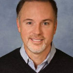 Headshot of Paul Bush, real estate agent