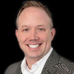 Headshot of Adam Noss, real estate agent