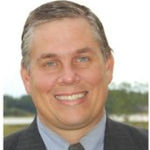 Headshot of Chris Kuhn, real estate agent