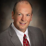 Headshot of Scott Henning, real estate agent