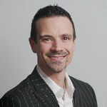 Headshot of Colter Doty, real estate agent
