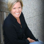Headshot of Eva Hygrell, real estate agent
