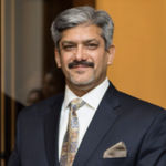 Headshot of Tarique Malik, real estate agent
