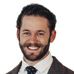 Headshot of Aaron Medeiros, real estate agent