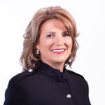 Headshot of Lydia Memeti, real estate agent