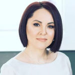 Headshot of Alia Asanova, real estate agent
