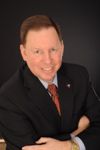 Headshot of Dayton Schrader, real estate agent