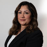 Headshot of Adoracion Enriquez, real estate agent