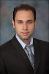 Headshot of Alex Bortniker, real estate agent