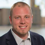 Headshot of Andrew Brisson, real estate agent