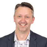 Headshot of Travis Wyman, real estate agent